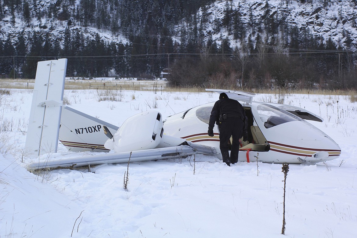 A small twin-propeller airplane crashed Tuesday, Jan. 3, at about 9:15 a.m. approximately 200 yards behind the Montana Rail Link railroad in Paradise. (Douglas Wilks photos/Clark Fork Valley Press).