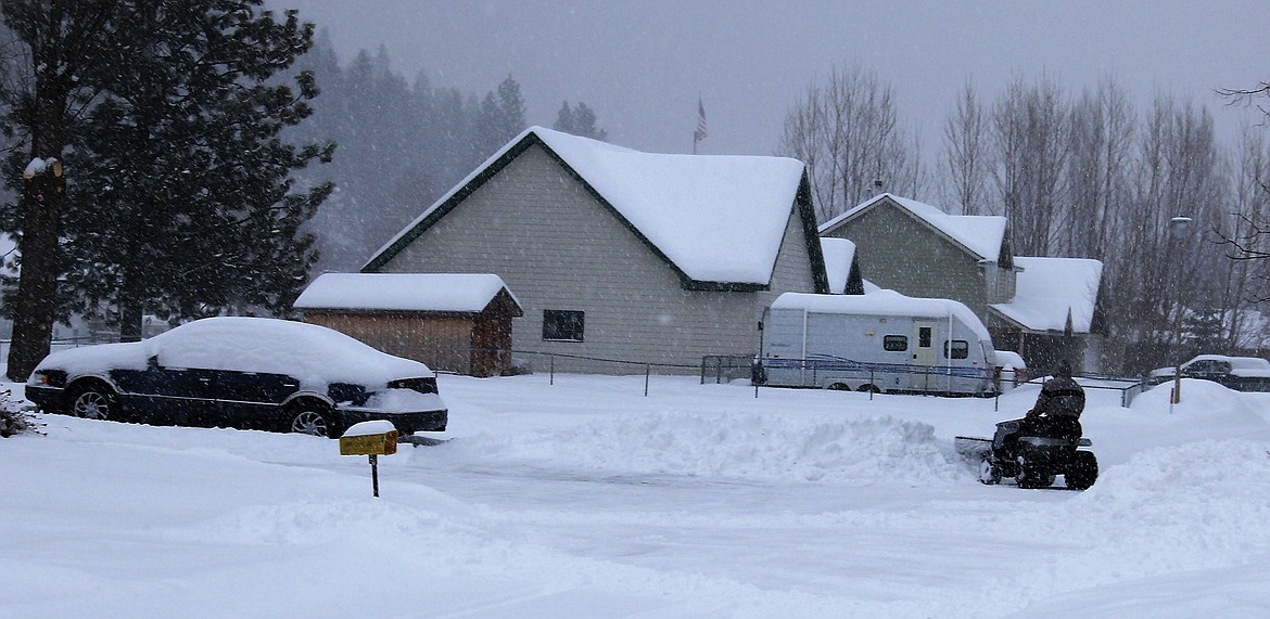 Homeowners plowed streets and sidewalks after Monday&#146;s snowstorm, which dumped up to ten inches on the Clark Fork Valley.