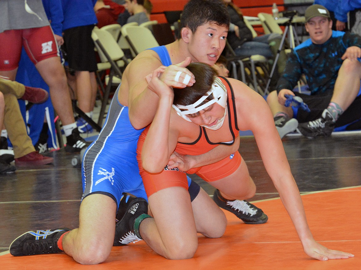 RONAN WRESTLER Justin Mays battles with a member from the Japan National team at Montana Western Duels Friday at the Ronan Events Center. (Jason Blasco/Lake County Leader)