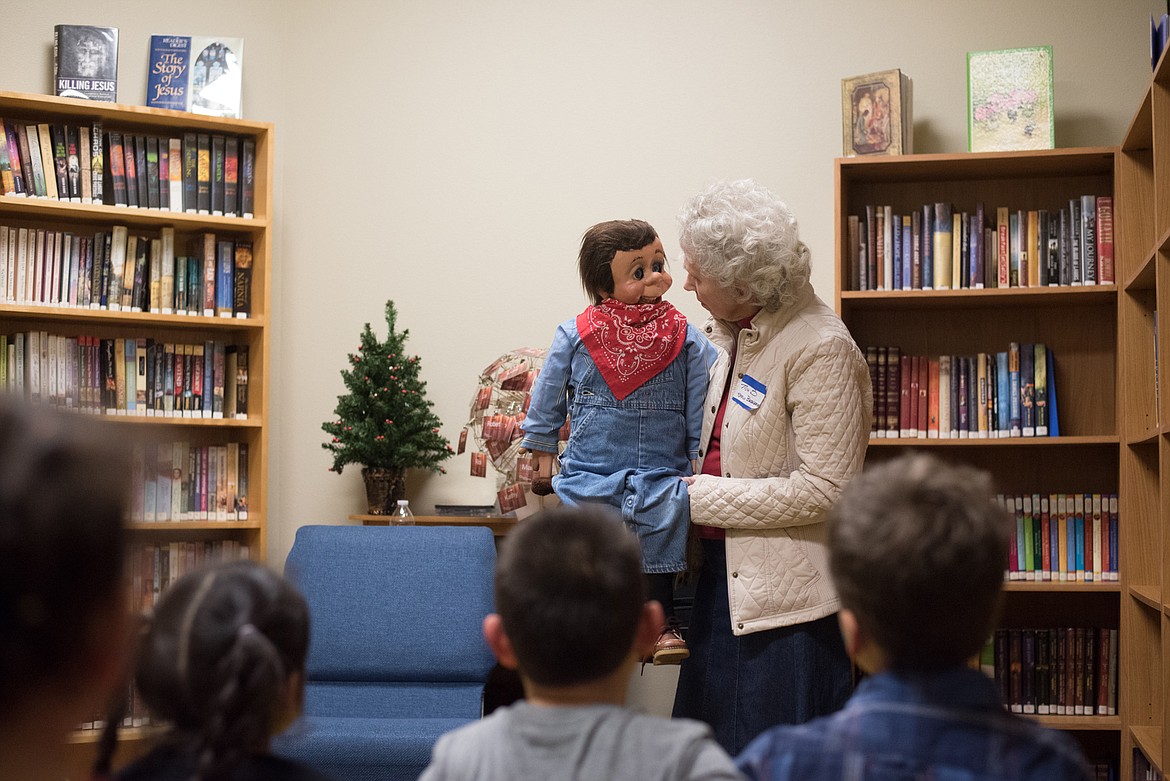 Courtesy Photo - Stella Besherse shared stories in the library with her friend Roscoe.