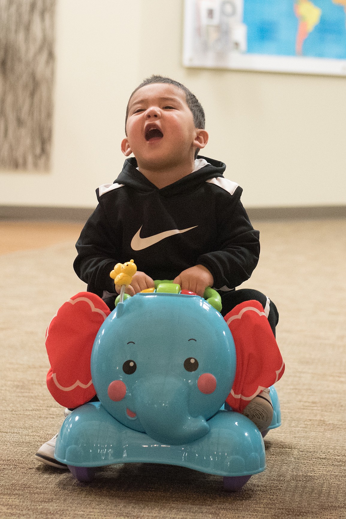 Courtesy Photo - A little boy takes a new toy he found in the &#147;Free Room&#148; for a spin.