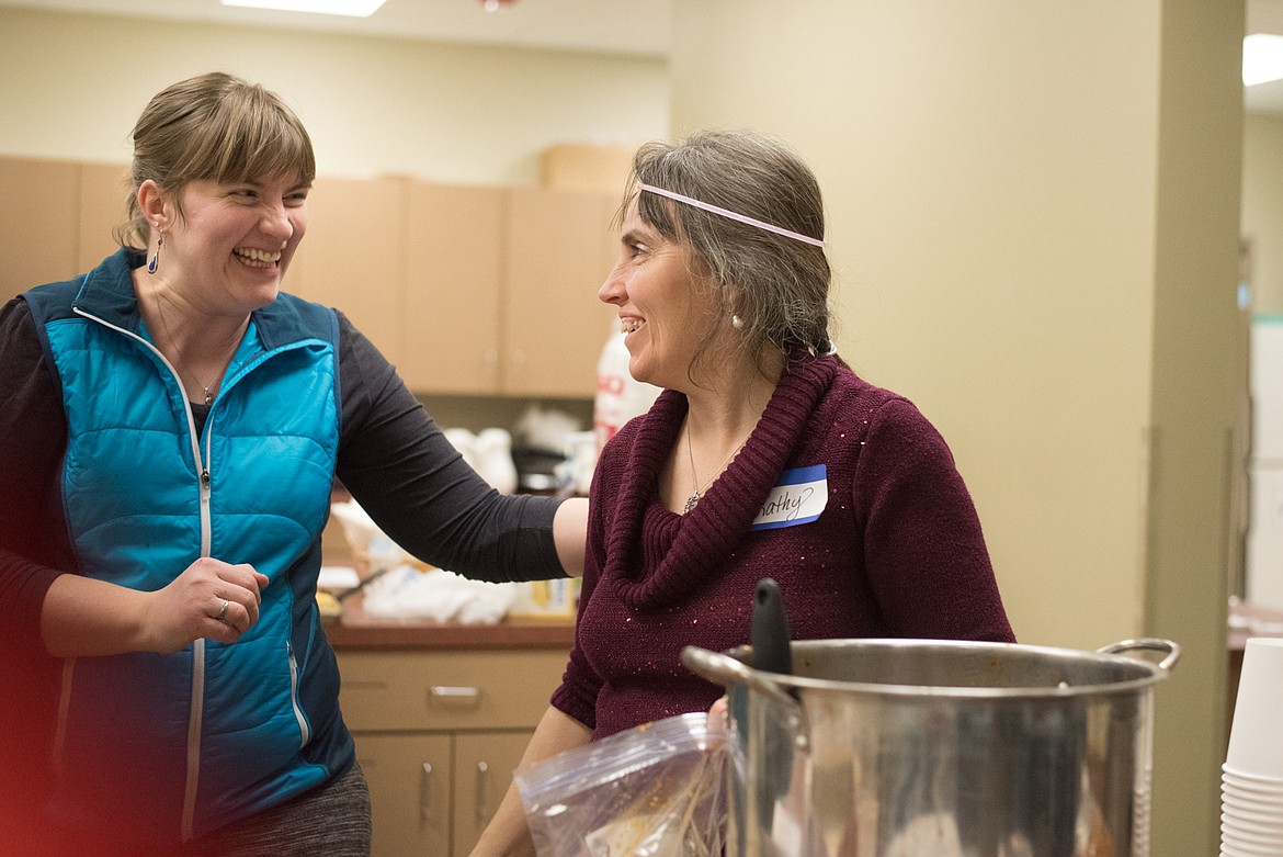 Courtesy Photo - Event the volunteers Carly Klemple and Kathy Oord were in a happy mood. They were responsible for the chili feed.