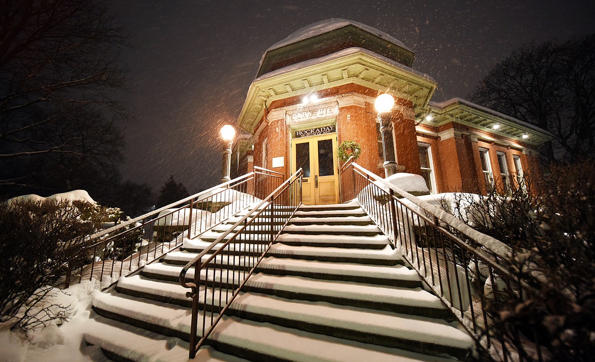 A fresh layer of snow begins to cover the Hockaday Museum of Art on Sunday evening in downtown Kalispell. (Brenda Ahearn/Daily Inter Lake)