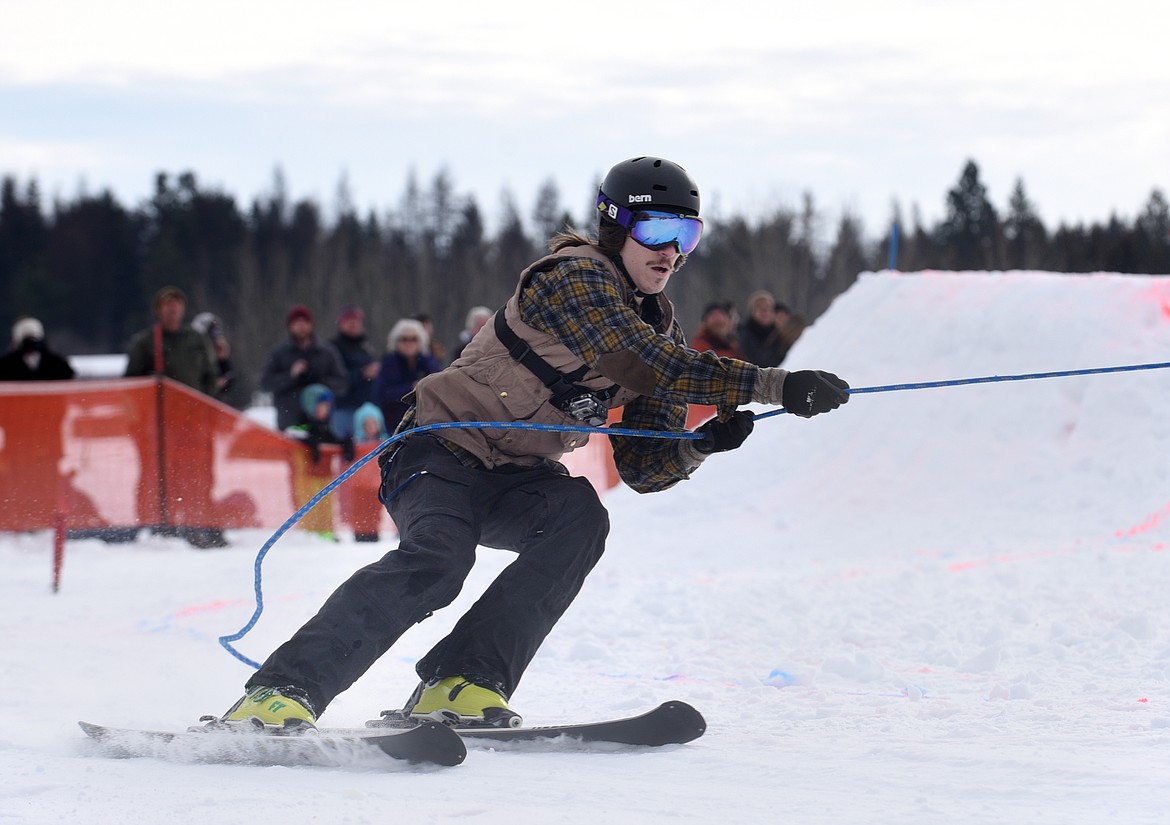 A SKIER turns the corner during the sport division.