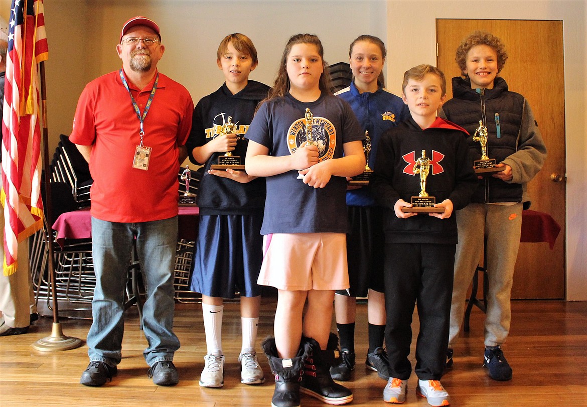 Courtesy photo
Six Coeur d&#146;Alene youths competed at the 2017 Idaho North District Hoop Shoot championships in Kellogg last weekend. From left are Coeur d&#146;Alene Hoop Shoot director Rick Alexander, boys 12-13 year-old champion Taylor Menti, girls 8-9 third-place finisher Laythia Warner, girls 12-13 year-old champion Alexis Blankenship, boys 8-9 year-old champion Jace Taylor and boys 10-11 year-old champion Deacon Kiesbuy. Not pictured is girls 10-11 year-old champion Kamryn Pickford.