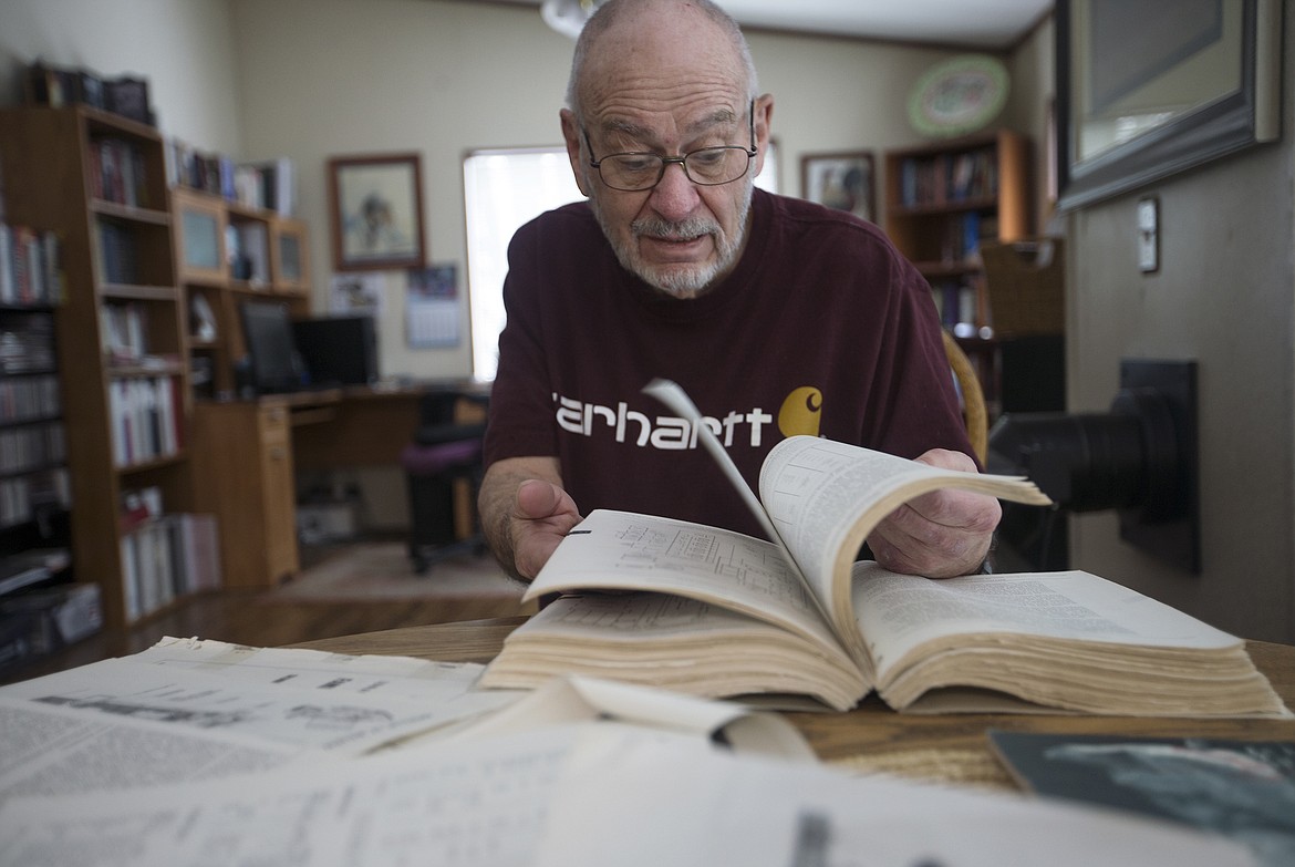 Photos by LISA JAMES/ Press
Retired engineer and technical writer Vern Westgate, as he flips through technical manuals from his time working for North American Aviation, talks about his involvement with the Apollo 1 mission. Jan. 27 is the 50th anniversary of the cabin fire that killed three American astronauts during a pre-launch test for the Apollo 1 mission. Westgate wrote the technical manual for the Apollo and was the liaison between the astronauts and the engineers, providing feedback for its development.