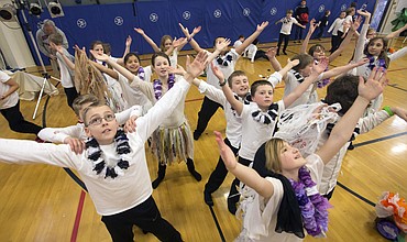 LISA JAMES/ PressSorensen Elementary School 5th and 6th graders dance to the music blaring into the gym after the conclusion of their Aloha Day performance on Friday. As part of the program, students performed different types of Hula, incorporating the lessons in history, culture, legend, language and the natural environment of Hawaii that this year's artist-in-residence Bria Zan Thompson brought to the school.