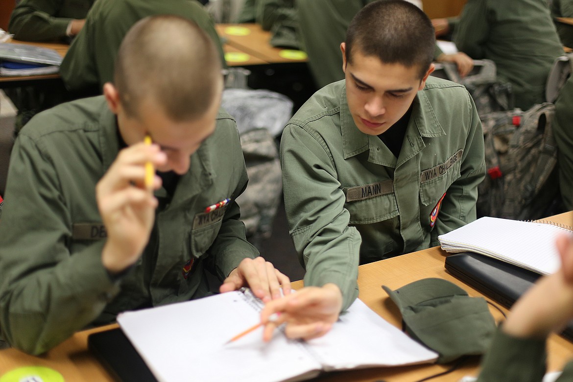 Washington Youth Academy/The Columbia Basin Herald
Cadet Gavin Mann helping another student during his time at the Washington Youth Academy in Bremerton last fall.