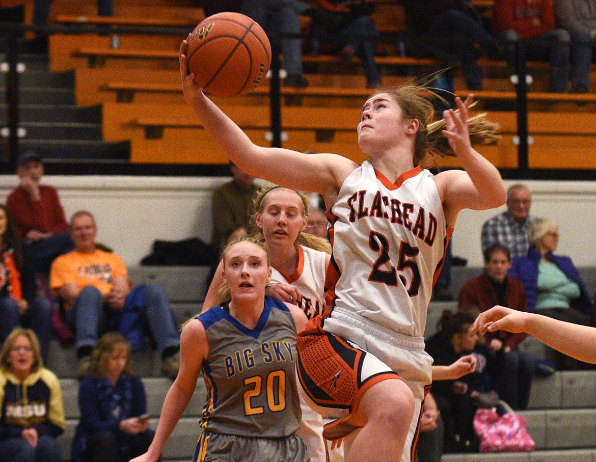 Flathead senior Allie Gagnon pulls down a rebound during the second quarter of the Bravettes' 43-29 win over Missoula Big Sky at Flathead on Tuesday. (Aaric Bryan/Daily Inter Lake)