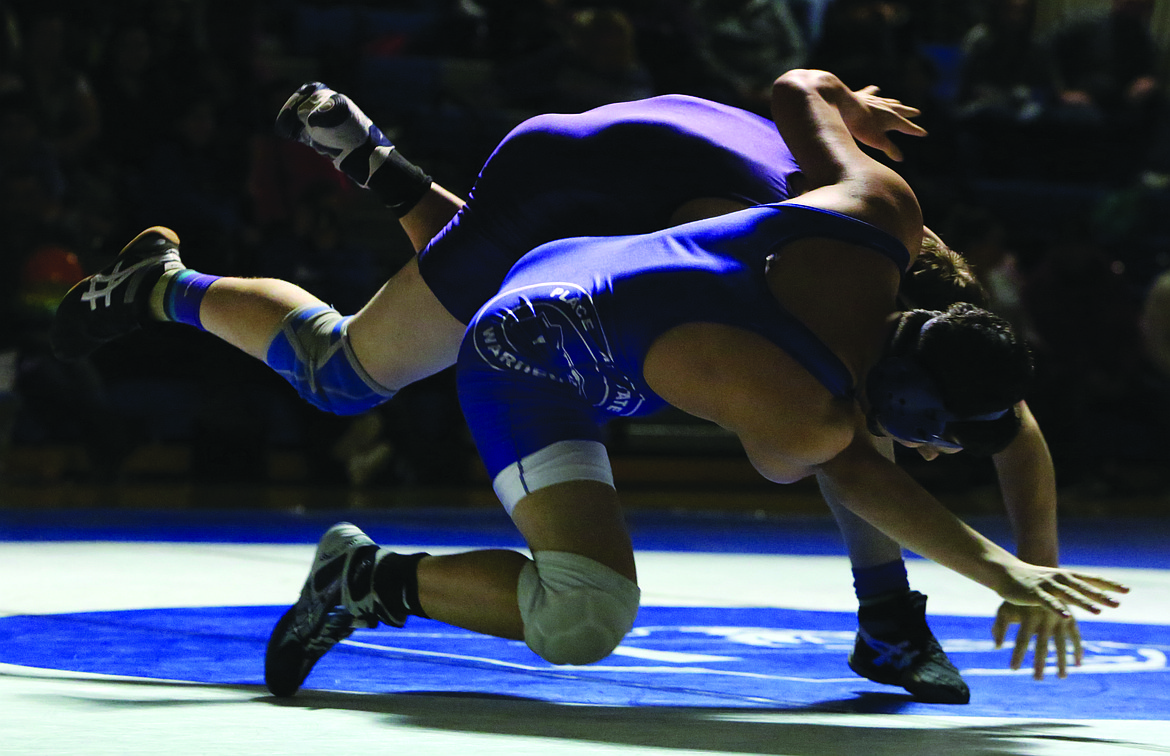 Connor Vanderweyst/Columbia Basin Herald
Warden's Robert Arredondo (blue) takes down Connel Neil with a hip toss.