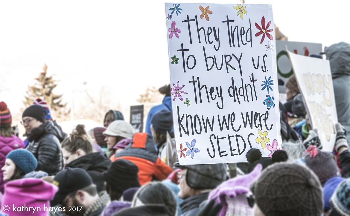 Many marchers carried signs in Helena on Saturday. (Photo by Kathryn Hayes)