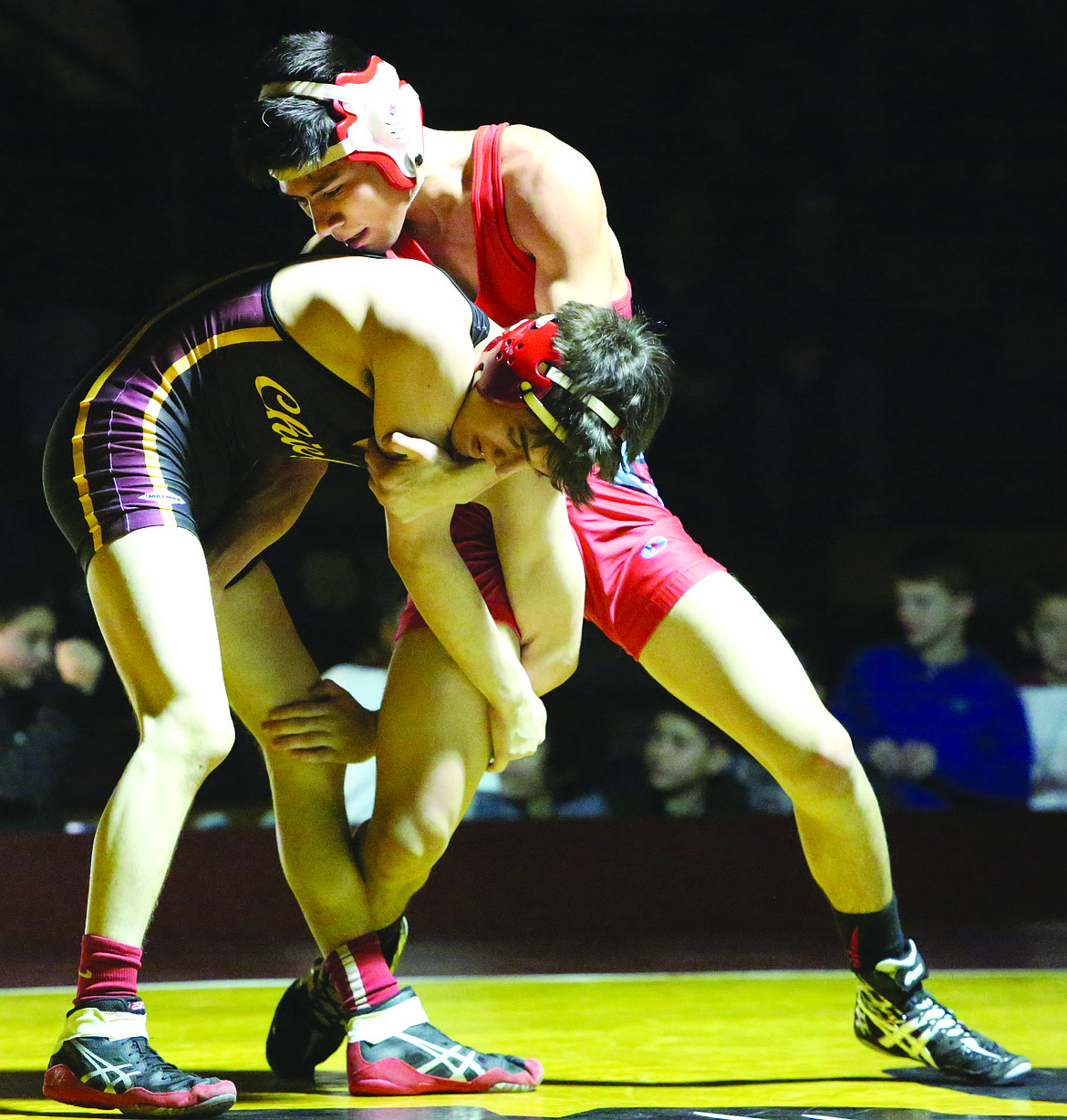 Connor Vanderweyst/Columbia Basin Herald
Spencer Humphreys gets tied up with Cesar Sitio of Eastmont.