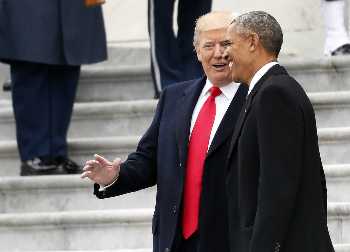 President Donald Trump and former President Barack Obama talk, as they pause on the steps of the East Front of the U.S. Capitol as the Obama's depart, Friday, Jan. 20, 2017 in Washington. (AP Photo/Alex Brandon)