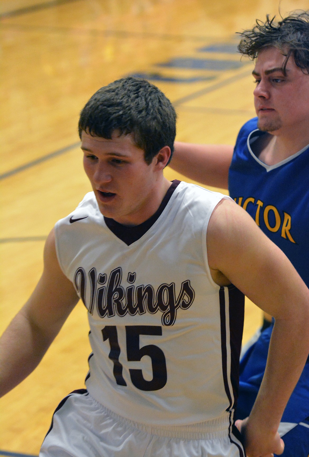 CHARLO HIGH School guard Landers Smith (15) drives to the basket in the second half against Victor Thursday night at Charlo High School. (Jason Blasco/Lake County Leader)