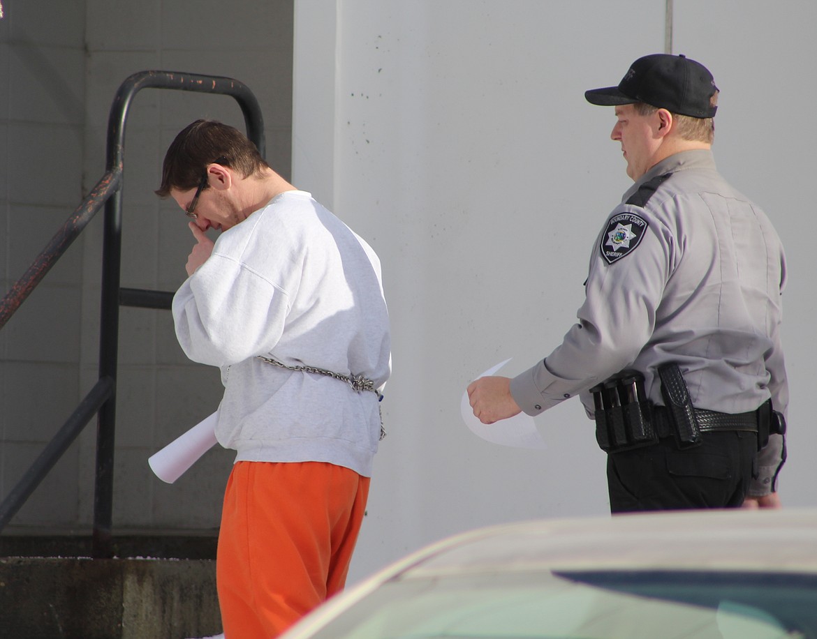 &#151;Photo by STAR SILVA 
Shane Kraly is escorted back to Boundary County Jail following his Jan. 19 sentencing.