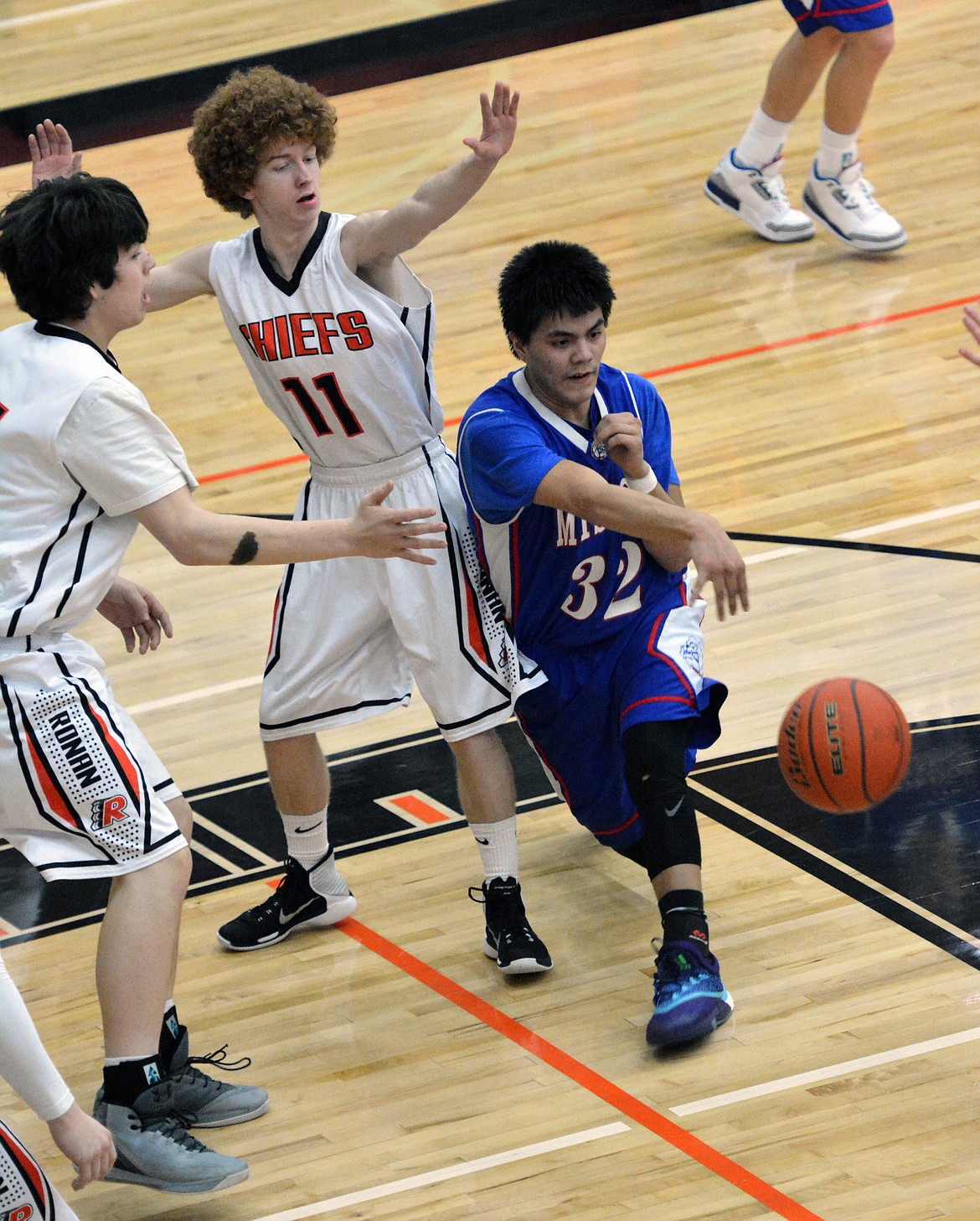 MISSION HIGH School basketball player Isaac Alexander passes through the Ronan Chiefs zone in the Class-B conference match between Ronan and Mission Thursday night at the Ronan Events Center. (Jason Blasco/Lake County Leader)