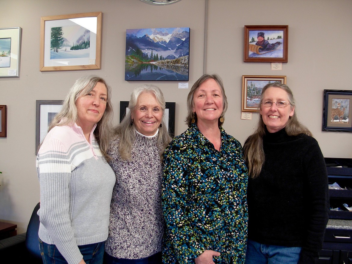 &#151;Courtesy photo
From left to right, Randee Foster, Darrelyn Rose, Debbie Aaron and Vicki Bleile pose for a photo in front of the &#147;Winter&#148; art exhibit, which will be on display in the lobby of Mountain West Bank until Feb. 13.