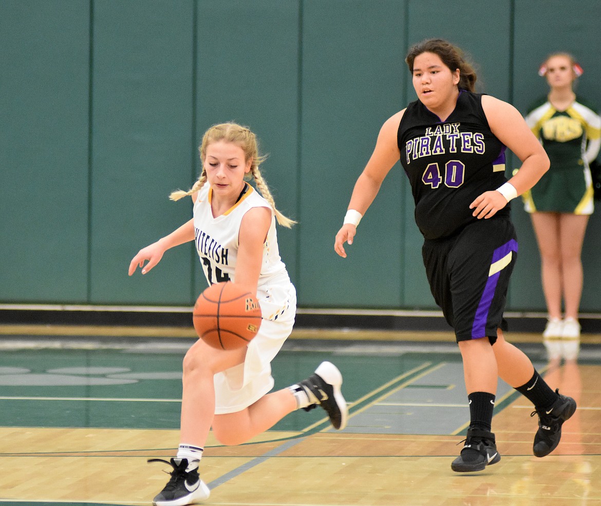 Lady Bulldog Diana Vasquez steals the ball from a Polson player Saturday during a loss at Whitefish High School. (Heidi Desch/Whitefish Pilot)