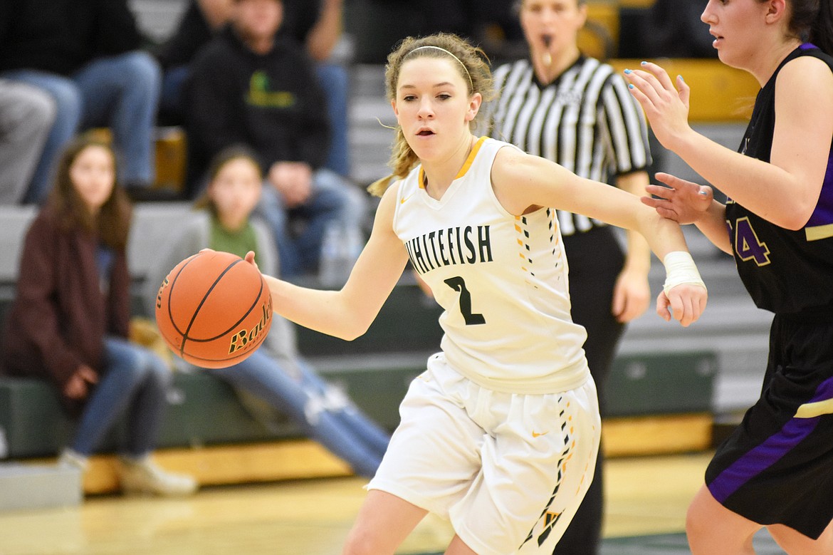 Lady Bulldog Lauren Schulz dribbles the ball around a Polson defender Saturday.