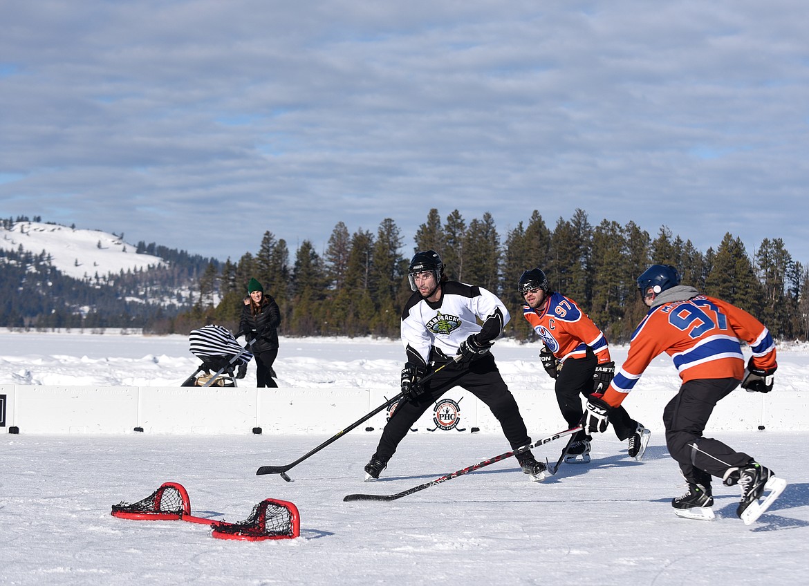 Tyler Gardner scores a goal during the Montana Pond Hockey Classic at Foys Lake on Friday. (Aaric Bryan/Daily Inter Lake)