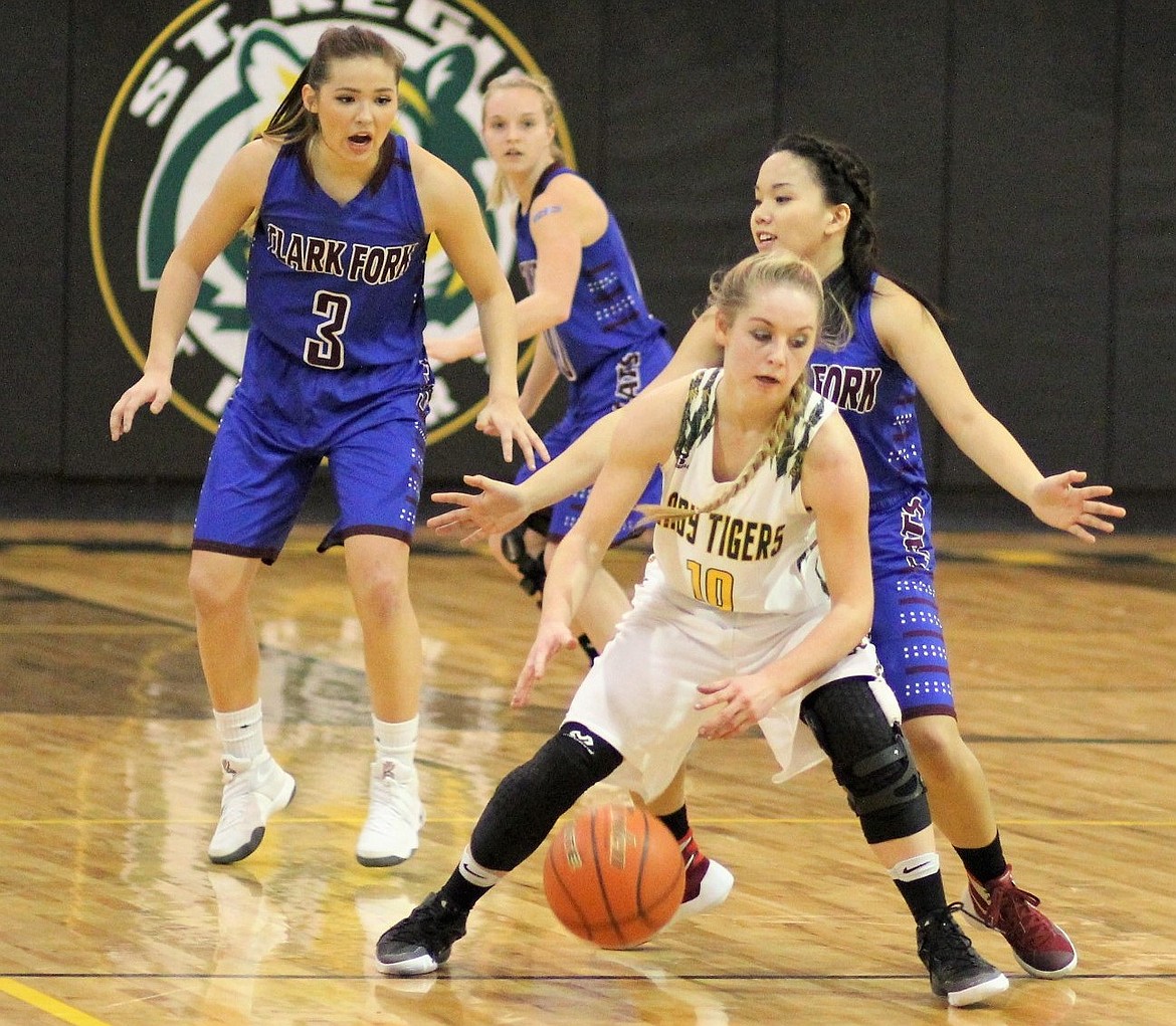 Lady Tiger Madison Hill (10) breaks away from Cats Kenzie Mueller (3) and Sophia Krutilla (2) during Thursday&#146;s game against the Clark Fork Mountain Cats. The Tigers won 55-53 in double-overtime. 



(Photos by Kathleen Woodford/Mineral Independent).