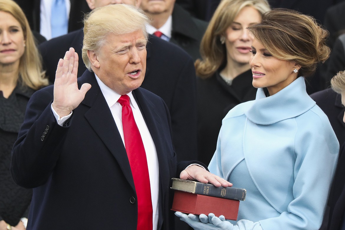 Donald Trump is sworn in as the 45th president of the United States as Melania Trump looks on during the 58th Presidential Inauguration at the U.S. Capitol in Washington, Friday, Jan. 20, 2017. (AP Photo/Andrew Harnik)