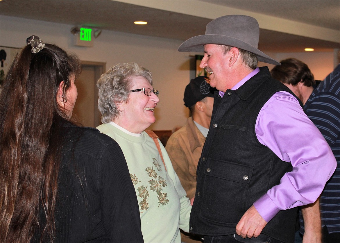 Retired Montana Highway Patrolman Roman Zylawy visits with guests at his party on Jan. 20 in St. Regis. (Kathleen Woodford/Mineral Independent).