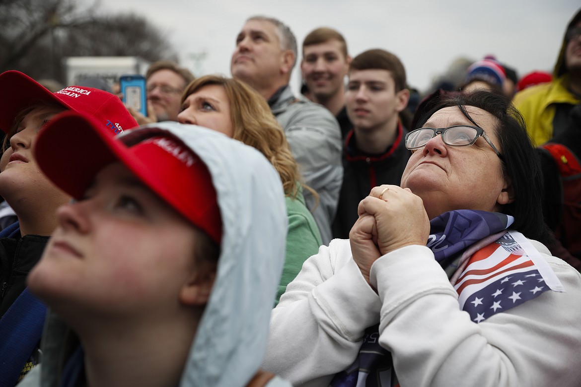 Supporters react as President-elect Donald Trump appears for his inauguration, Friday, Jan. 20, 2017, in Washington. (AP Photo/John Minchillo)