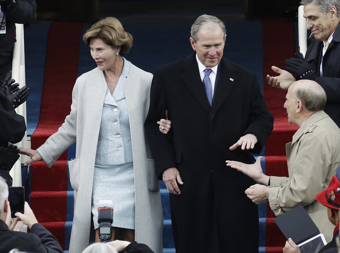 Former President George W. Bush and his wife Laura arrive for the 58th Presidential Inauguration at the U.S. Capitol for President-elect Donald Trump in Washington, Friday, Jan. 20, 2017. (AP Photo/Patrick Semansky)