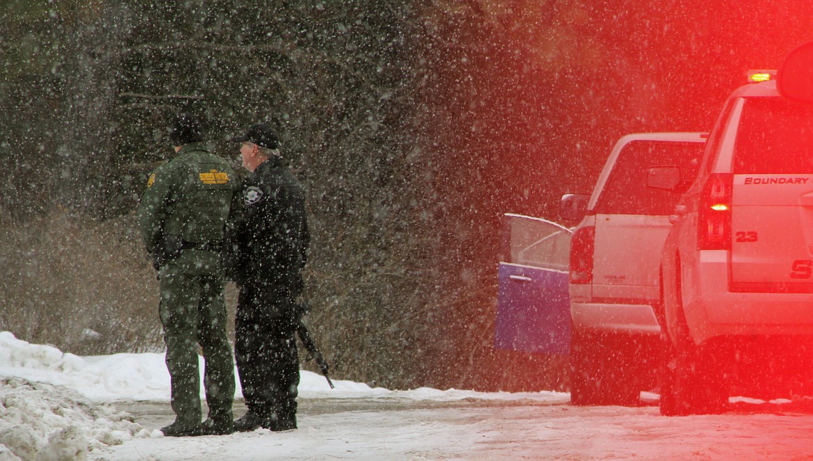 &#151;Photo by STAR SILVA
Boundary County Sheriff David Kramer coordinates efforts on Blume Hill Saturday to apprehend two male suspects during a multi-agency manhunt.