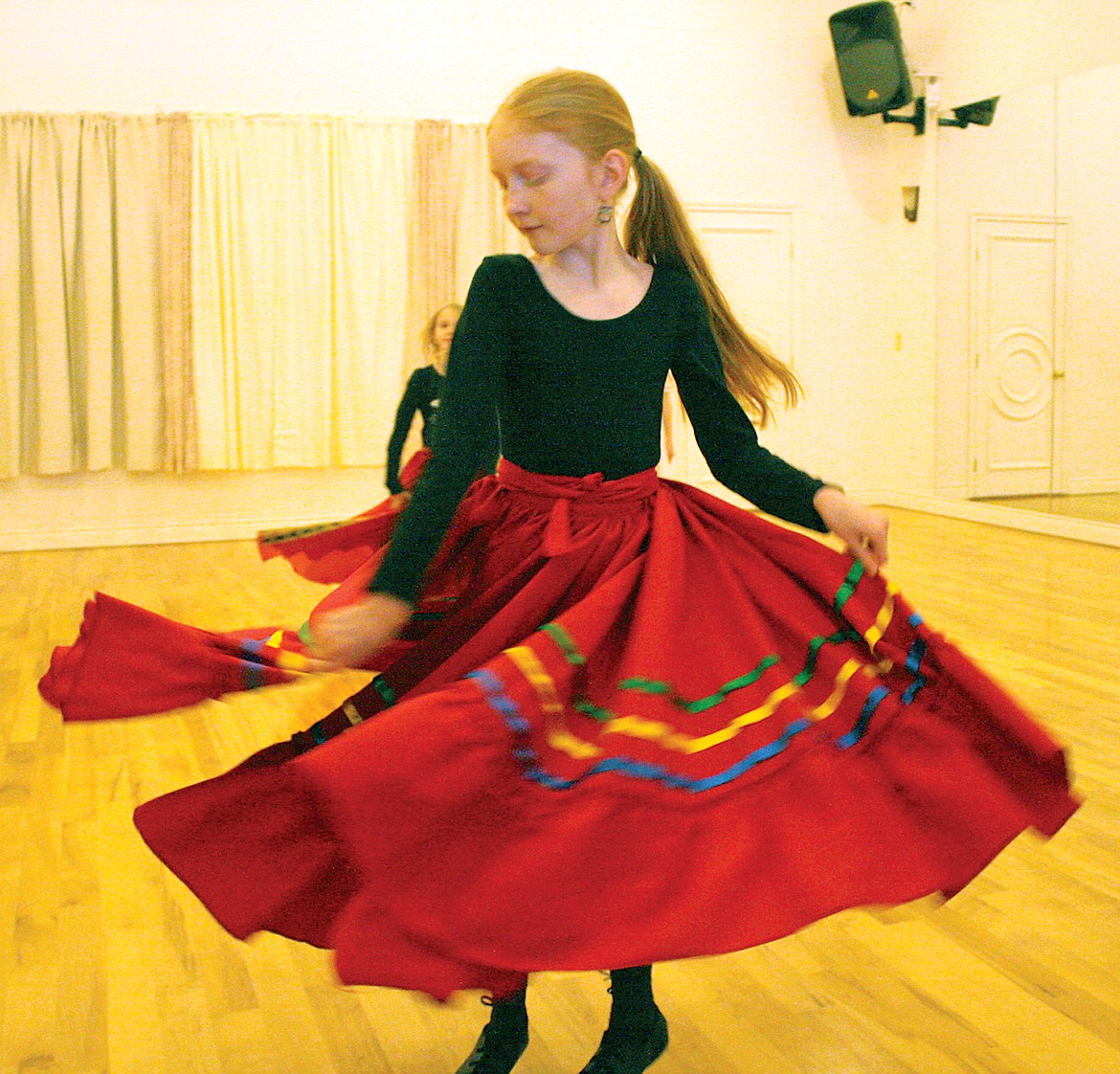 Audrey, of the kids ballet creative dance class, trying out a traditional Central American dancing skirt. (Bethany Rolfson/TWN)