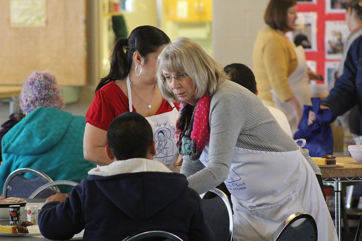 Richard Byrd/Columbia Basin Herald
Volunteers handed out free meals to those who showed up at Project Homeless Connect at Our Lady of Fatima Catholic Church on Thursday.