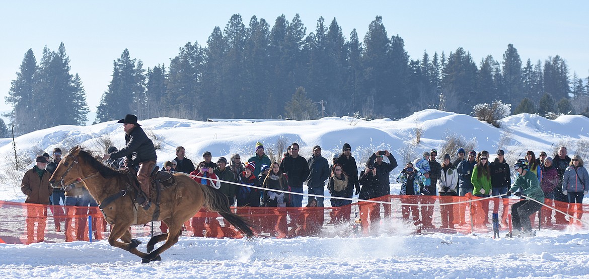 Todd Patterson pulls Tommy Sausen during the World Invitational Whitefish Ski Joring races on Sunday. (Daniel McKay photos/Whitefish Pilot)