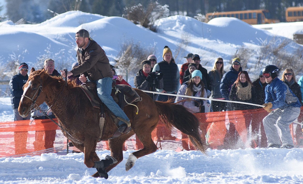 Dain Gillen and a skier kick off their race during Sunday&#146;s Whitefish Ski Joring event.