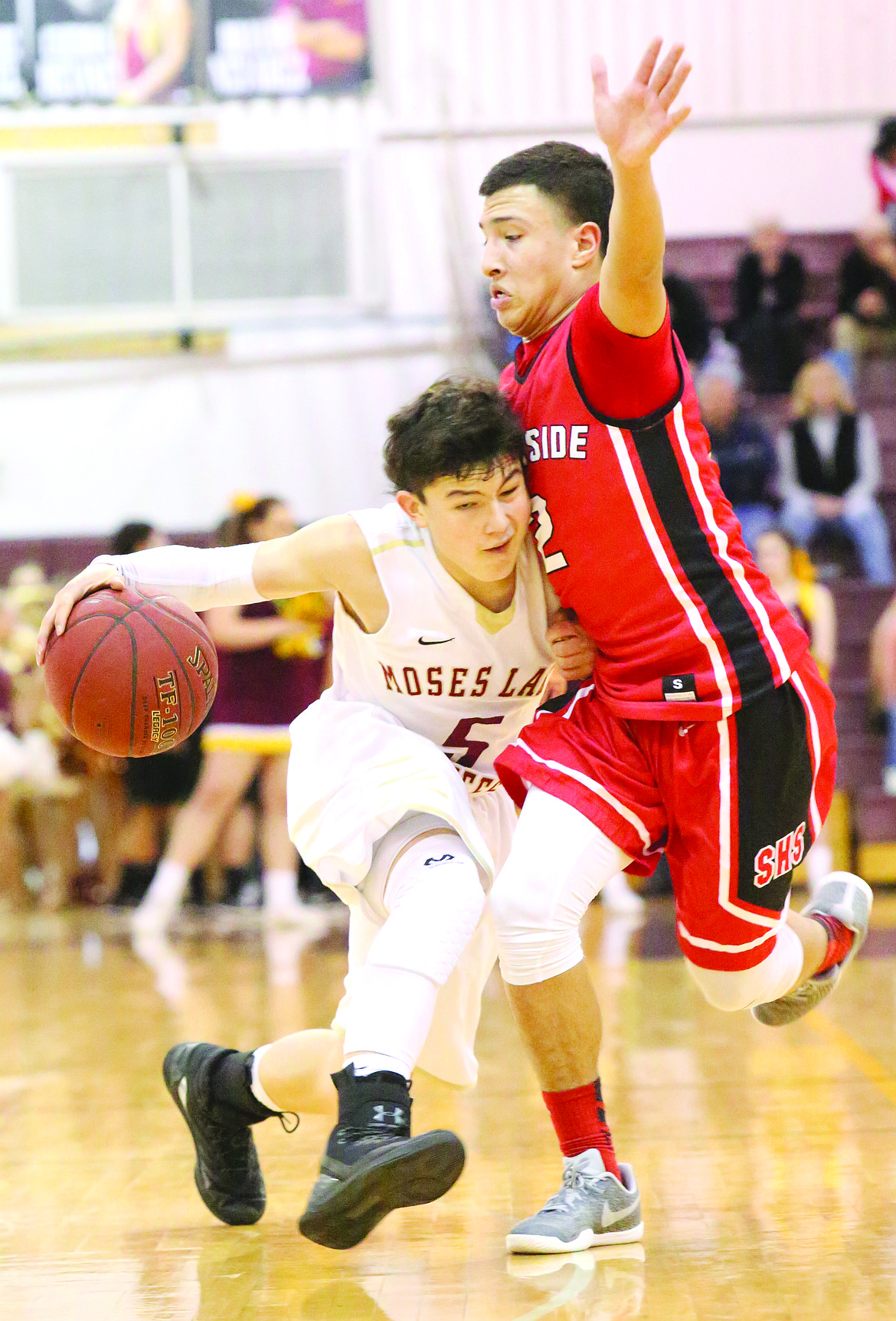 Connor Vanderweyst/Columbia Basin Herald
Moses Lake point guard Cory Kunjara tries to dribble past a Sunnyside defender.