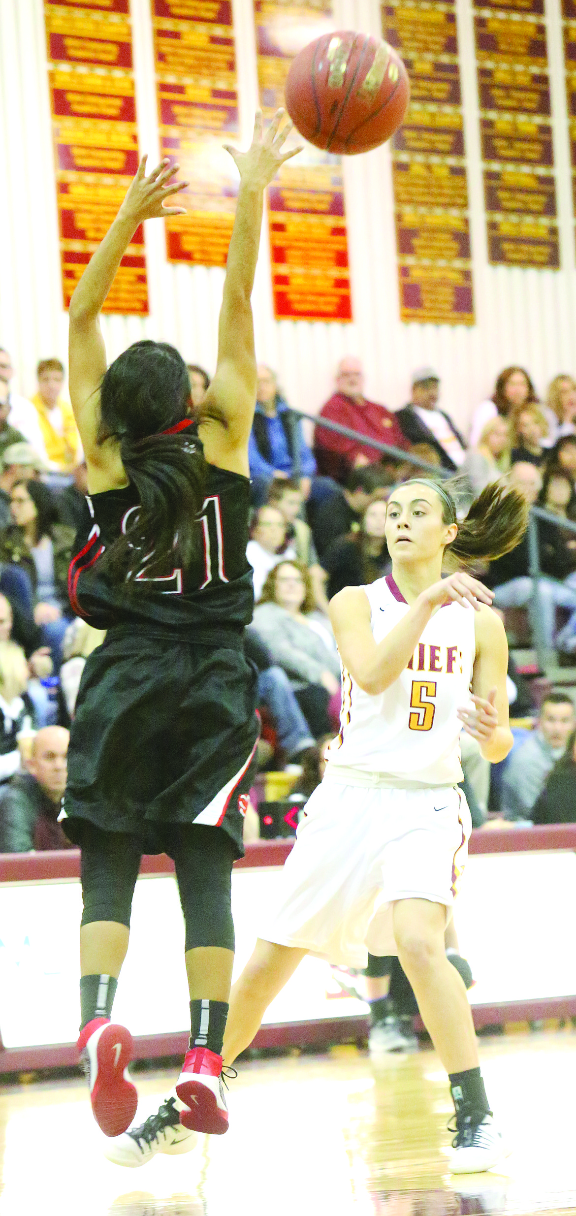 Connor Vanderweyst/Columbia Basin Herald
Moses Lake points guard Jamie Loera (5) throws a pass over the arms of Sunnysides Emilee Maldonado.