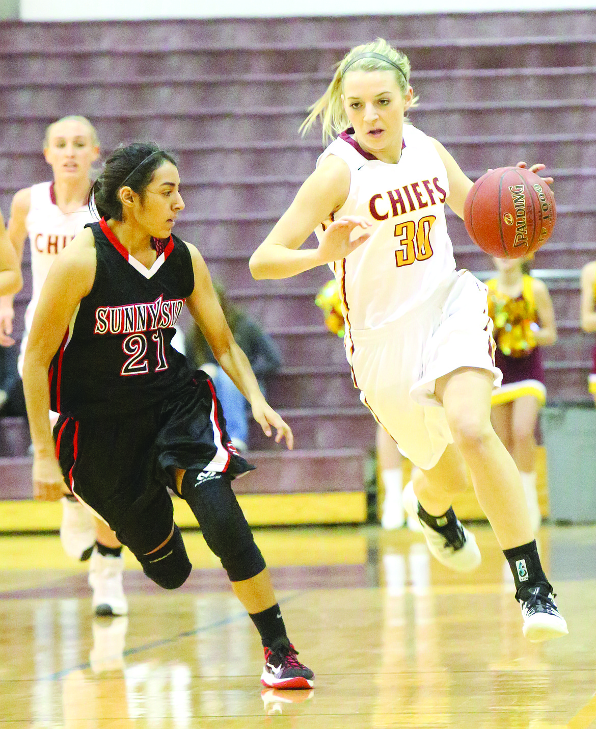 Connor Vanderweyst/Columbia Basin Herald
Moses Lake&#146;s Jessica Olson (30) dribbles up court against Sunnyside.