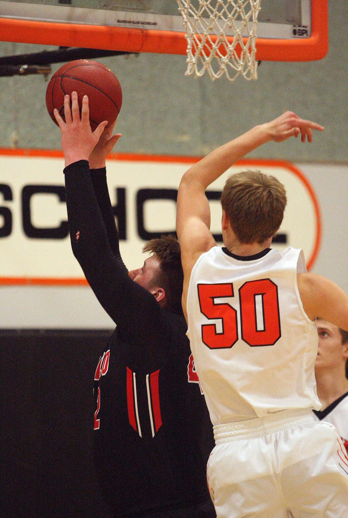 Rodney Harwood/Columbia Basin Herald
Othello senior Trenton Cutforth (42) hauls in a rebound over Ephrata forward Joshua Benthem (50) during Saturday&#146;s Central Washington Athletic Conference game in Ephrata. Cutforth finished with 14 points and 14 rebounds for the Huskies.