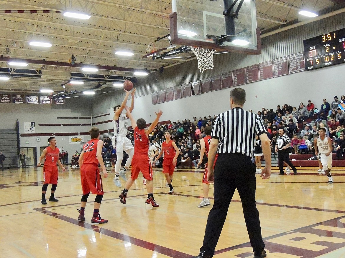 Ted Escobar/The Sun Tribune - Sergio Pineda flies high against River View to score on a jump shot from near the free throw line.