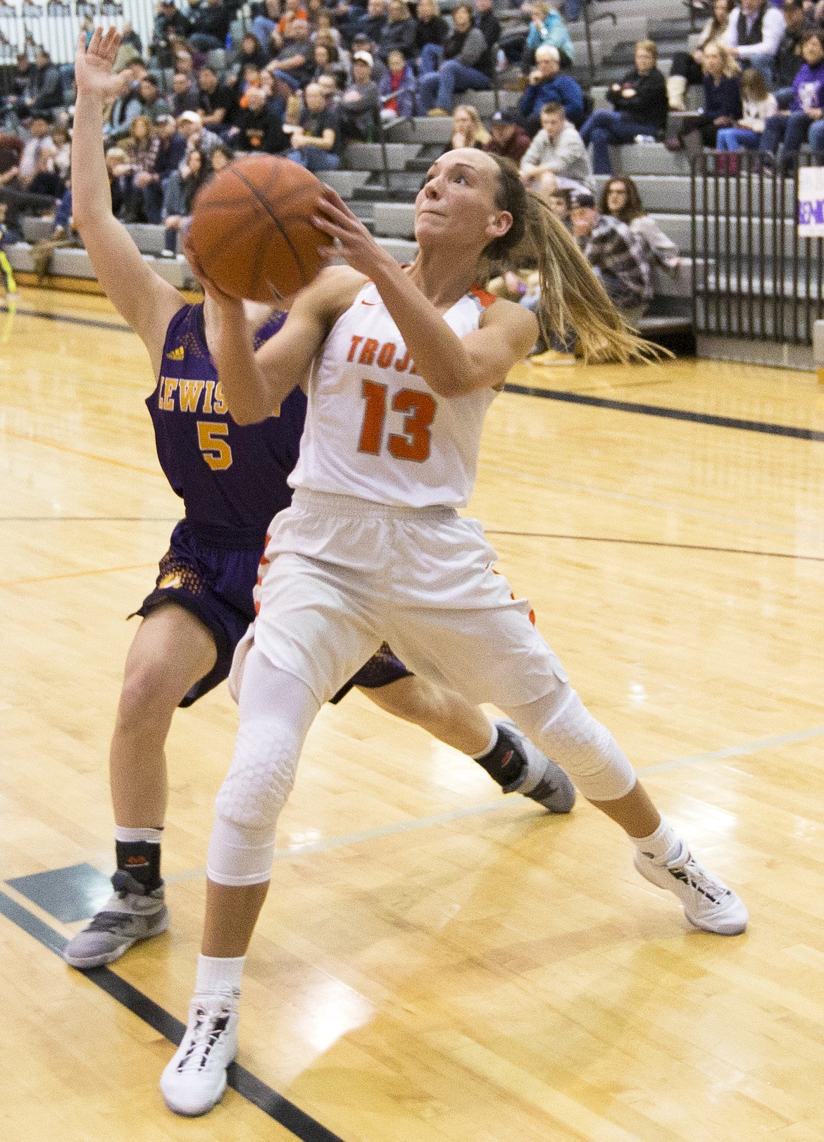 LISA JAMES/ PressBayley Brennan, #13, of Post Falls, shoots as Bryn Cornelia of Lewiston tries to block during their 5A Region 1 Championship game at Post Falls High School on Tuesday night. Post Falls won 53-39 to go on to the state championship in Boise.