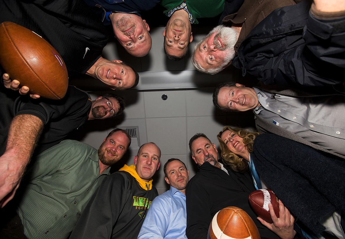 LOREN BENOIT/Press
All season long, a dozen local celebrities picked winners for every NFL game for the 2016-17 Coeur d&#146;Alene Press All-Star Pigskin Prognosticators competition.  Pictured counter-clockwise from Duffy Smock (blue shirt) are Rob Smith, Eve Knudtsen, Steve Griffitts, Vic Holmes, Ryan Davis, Jeff Conroy, Blaine Bennett, Jeff Runge, Mark Koerner and Tim Kiefer. Not pictured: John Beutler of Century 21 Beutler and Associates.