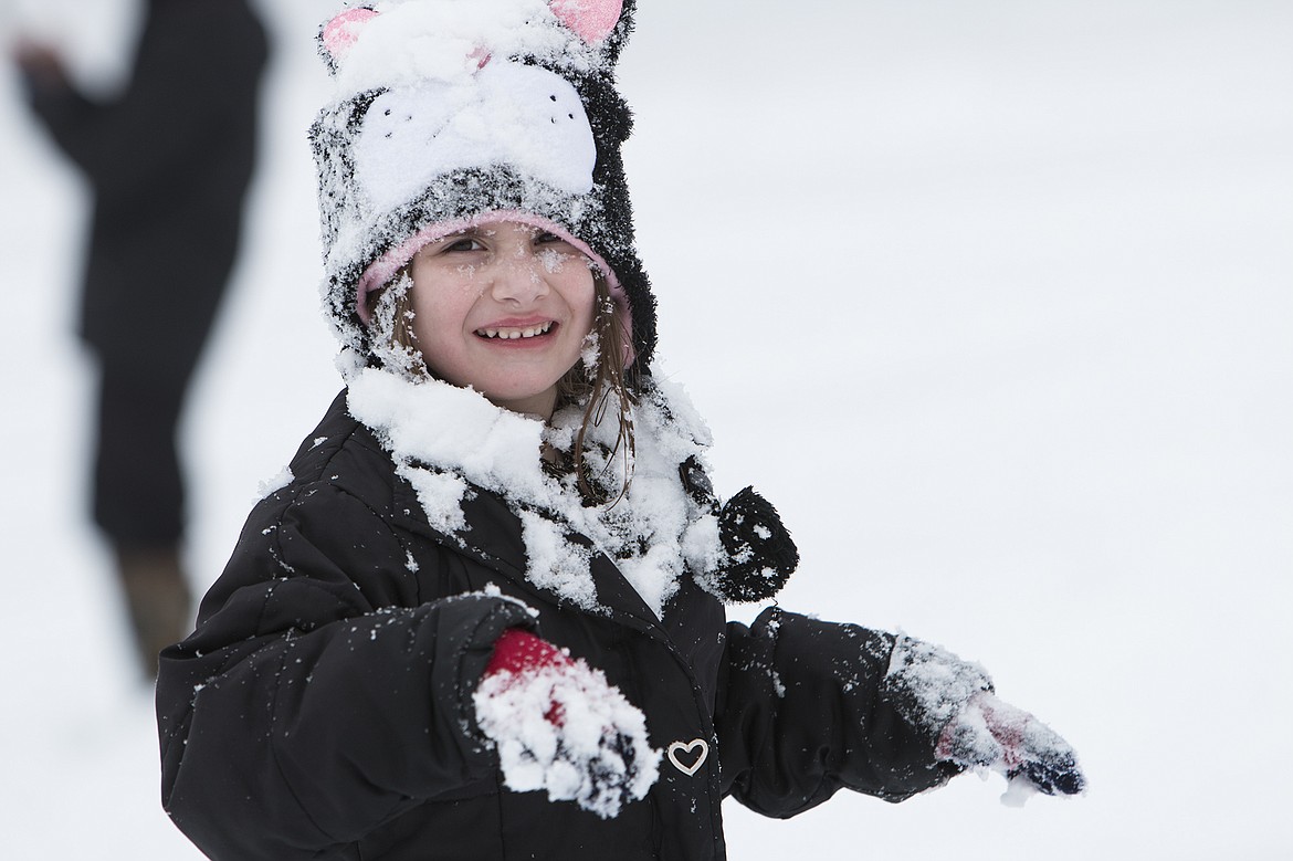 BETHANY BLITZ/PressNeela Baughman, 5, isn&#146;t sure what to think after getting smacked in the face with a snowball Saturday at Cherry Hill.