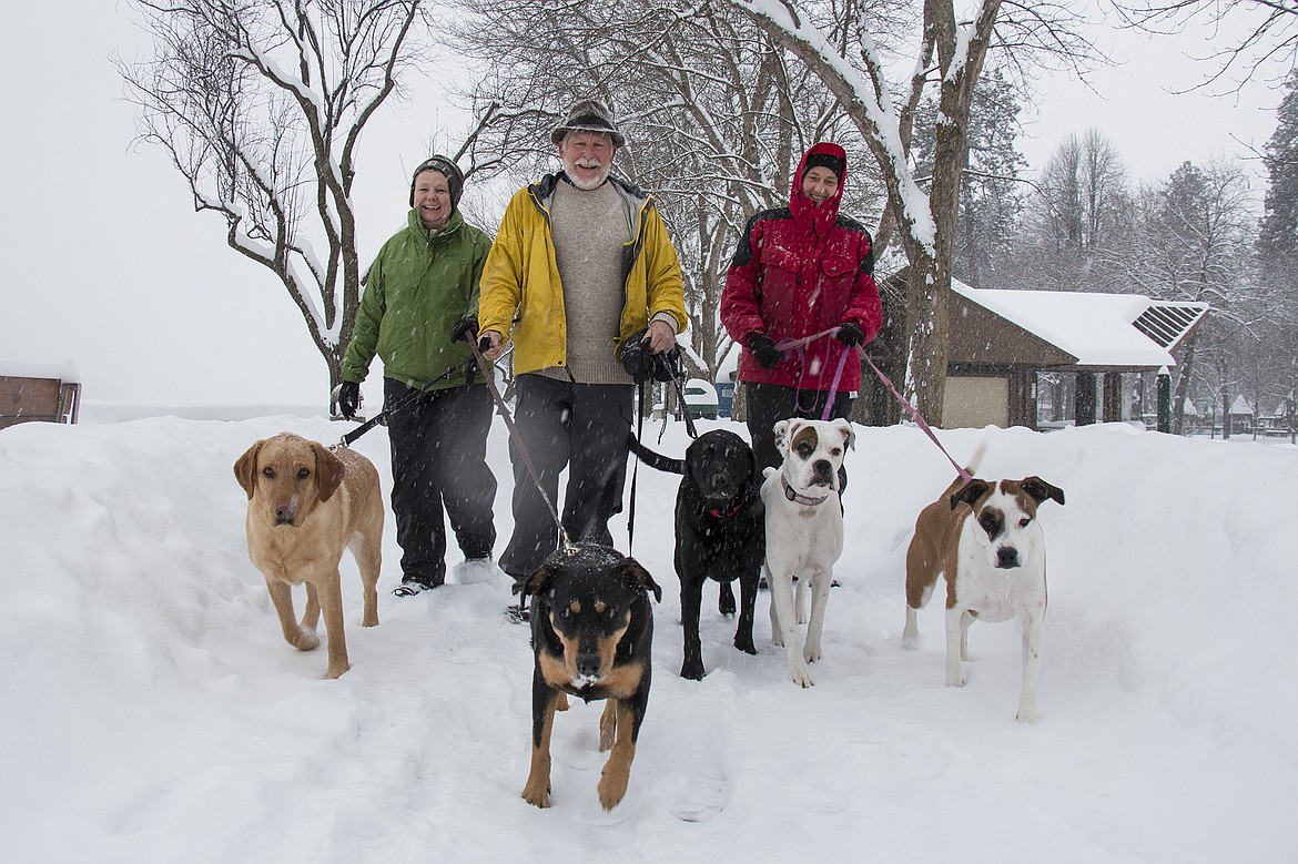 BETHANY BLITZ/PressFrom left to right, Leslie Parks, Tym Parks and Shelley Frei, from Moscow, walk their dogs in City Park Saturday.