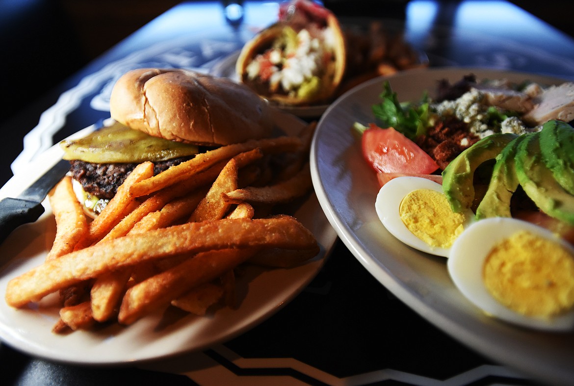 Three new dishes at Fatt Boys that have already become popular favorites are the Green Chili Burger, left, the Cobb Salad, right, and the Greek Gyro.(Brenda Ahearn/Daily Inter Lake)