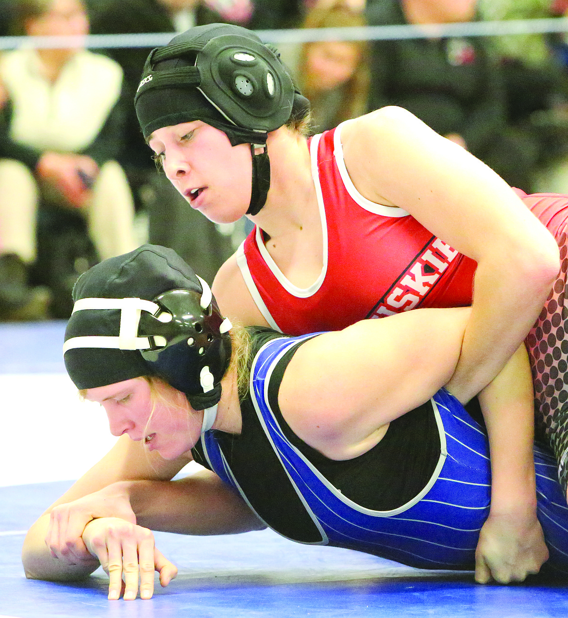 Connor Vanderweyst/Columbia Basin Herald
Othello's Kaylee Martinez (red) controls Wilbur-Creston's Taylor Strozyk from the top position in the district semifinals.