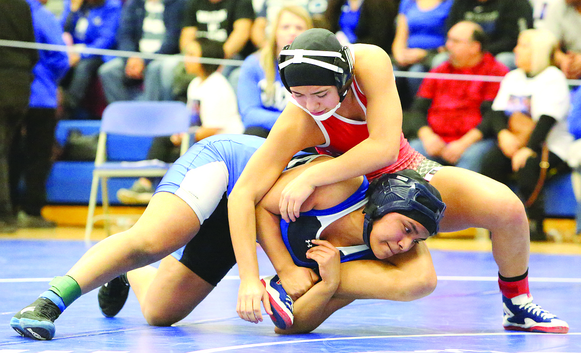 Connor Vanderweyst/Columbia Basin Herald
Othello's Nikki Velazquez (red) tries to free her leg from Kiona-Benton's Maria Mondragon.