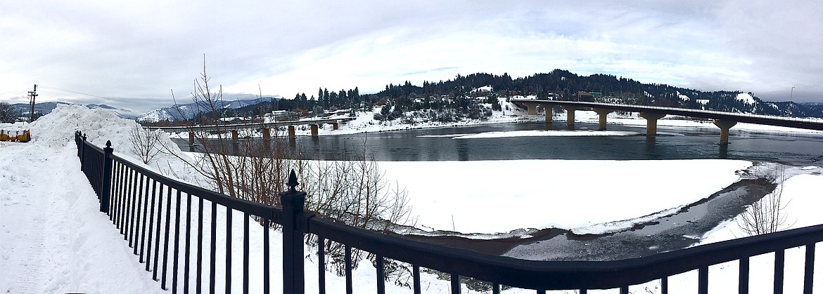 &#151;Photo by STAR SILVA
In this panoramic photo, fresh snow can be seen filling a portion of the Kootenai River after heavy snowfalls this week. City of Bonners Ferry Mayor David Sims said the Idaho Department of Environmental Quality gave the city permission to dump excess snow into the river because the city&#146;s regular snow storage located off of Arizona Street reached capacity. About 200 loads of snow has been dumped into the river since Sunday. Sims said only fresh snow retreived from the downtown area that is free of salt and oil residue is disposed of in the river. 
&#147;We would like to thank residents for their patience as we remove the excess snow from the downtown area,&#148; Sims said.
Sims said the city has not requested assistance from the state, but may have to consider that if the coming snow and rain cause flooding.