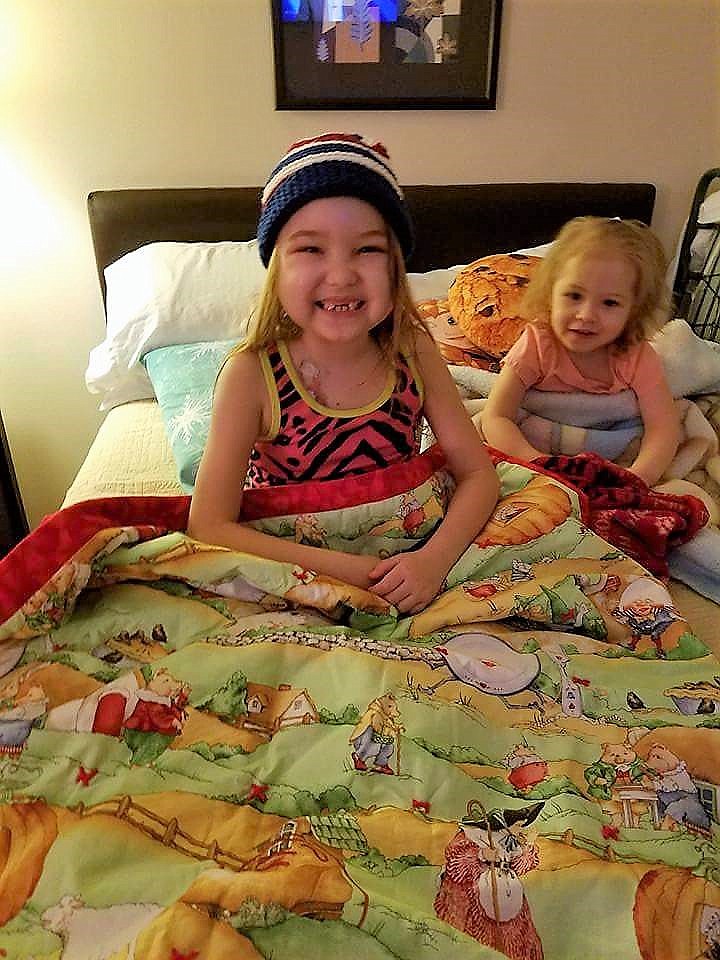 Six-year-old Kaylee received a quilt from the Cabin Fever Quilt Guild while undergoing treatment for leukemia in January.  (Photo courtesy of the Cabin Fever Quilt Guild).
