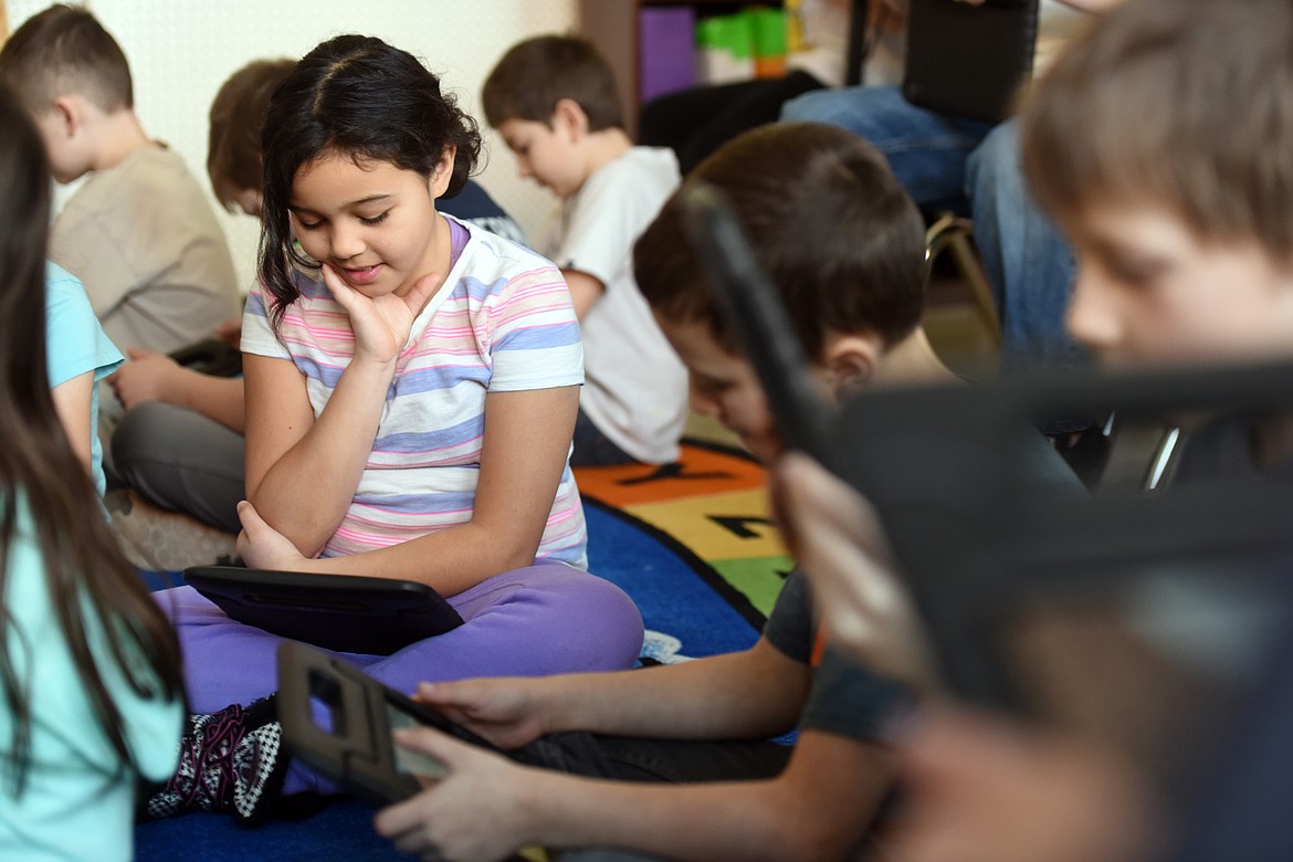 Ella Donohuue works on a lesson related to ancient Egypt on her new tablet in Brooke Samson&#146;s third grade class on Thursday, February 2, at Hedges Elementary School.
(Brenda Ahearn/Daily Inter Lake)