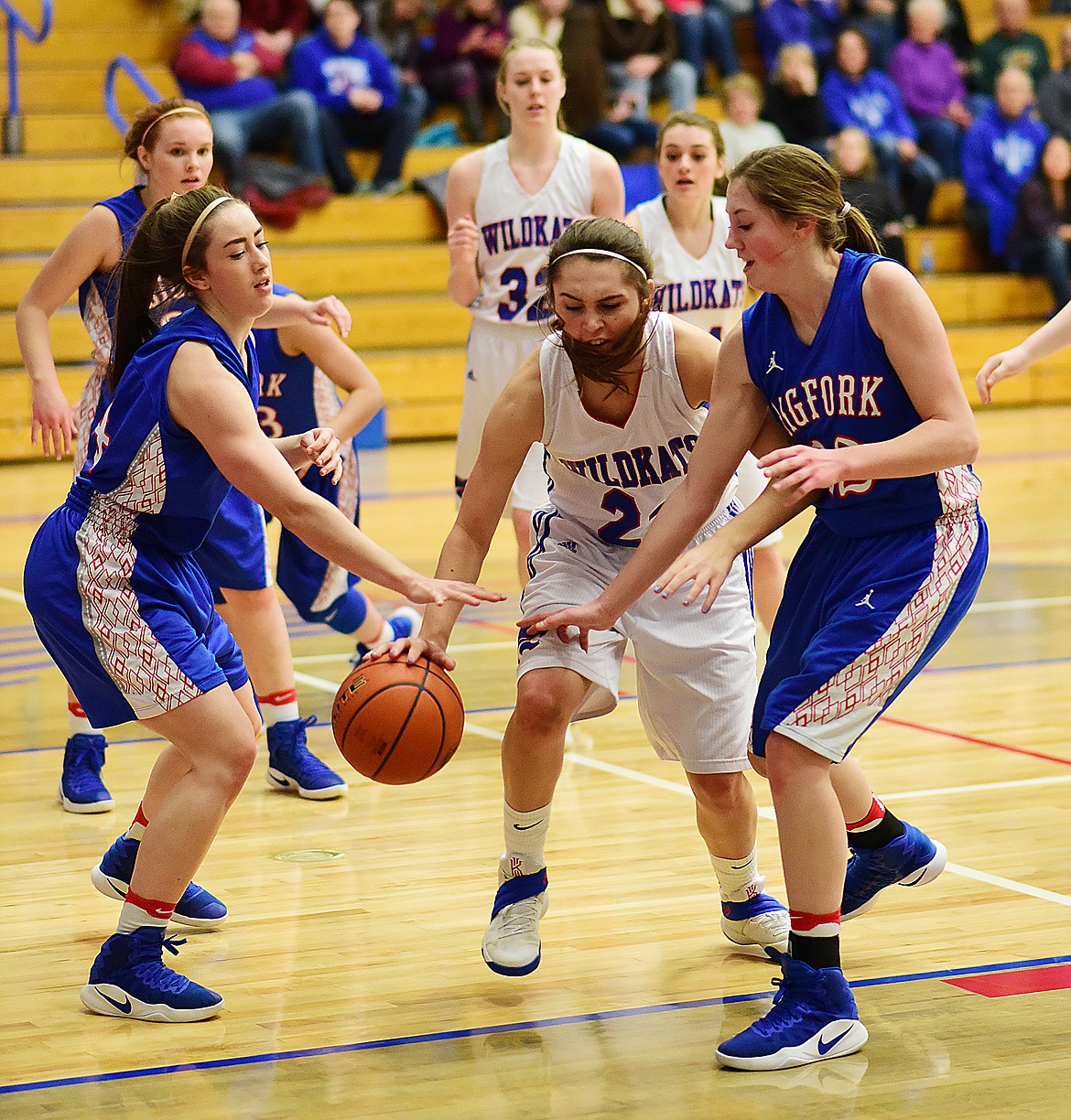 Peyton Kehr, center,  looks to split the Bigfork defense.